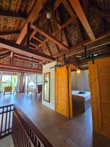 a large room with a bedroom and a bed at Emerald Oasis Pool Villa Koh Tao in Ko Tao