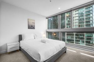 Luxurious apt In Southern Cross-Harbour Views 3B2B 객실 침대