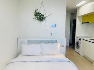 Kuchyň nebo kuchyňský kout v ubytování OceanStay E7 INN-TheCity