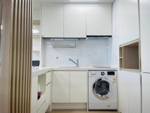 Kuchyň nebo kuchyňský kout v ubytování OceanStay E7 INN-TheCity