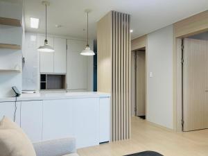 Kuchyň nebo kuchyňský kout v ubytování OceanStay E7 INN-TheCity