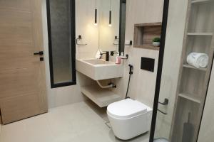 a bathroom with a white toilet and a sink at Moon mountain resort in Sharm