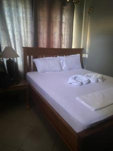 Postel nebo postele na pokoji v ubytování Peaceful Nest-Dar