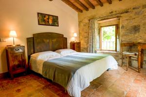Postel nebo postele na pokoji v ubytování Agriturismo Podere Costarella
