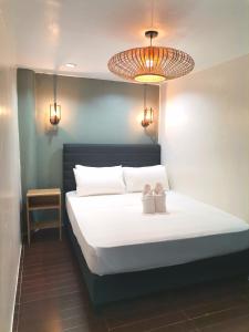 Postel nebo postele na pokoji v ubytování Viewpoint 360 Hotel