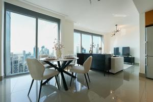 a dining room with a table and chairs with a view at Luxurious 1BR in Opera Grand 5 mins walk to Burj Khalifa in Dubai