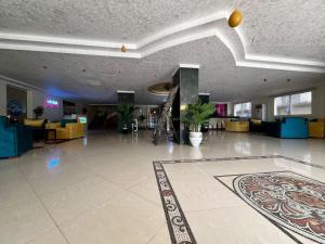 a large lobby with a rug on the floor at Sea Life Apartments-hotel in Hurghada