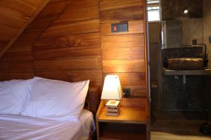 Postel nebo postele na pokoji v ubytování Paradise Point Nature Cabana Kandy
