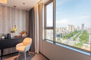 Balkon lub taras w obiekcie Calvin International Hotel Guangzhou Baiyun International Airport Huadu Plaza Branch - Free Deliver Service to Guangzhou Baiyun International Airport & Free Deliver Service to Canton Fair Complex During Canton Fair Period