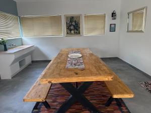 a wooden table in a room with a sink at Calypso beach holiday in Langebaan