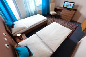 Postel nebo postele na pokoji v ubytování Sareza hotel