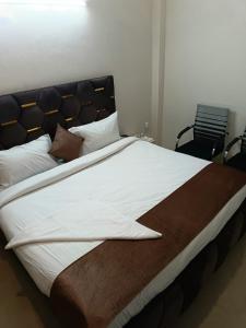 Postel nebo postele na pokoji v ubytování Soooper Hotel
