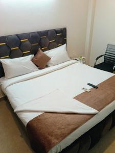 Postel nebo postele na pokoji v ubytování Soooper Hotel