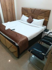 Postel nebo postele na pokoji v ubytování Soooper Hotel