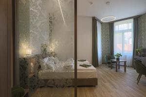 a hotel room with a bed and a living room at Turul Villa in Sovata