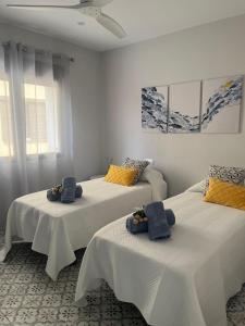 Ένα ή περισσότερα κρεβάτια σε δωμάτιο στο Montgó Vista Residence