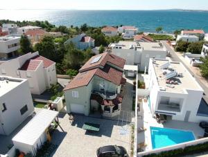 an aerial view of a house with a swimming pool at Apartment ErMa in Zaton