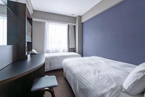 Hotel Odashima客房内的一张或多张床位