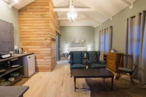 a living room with a couch and a table at The Cabins Hogsback in Hogsback