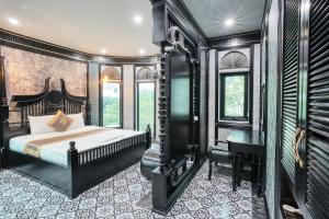 a bedroom with a bed and a desk at Bao Ngọc Hotel Dương Nội in Hanoi