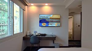 Rúm í herbergi á Hub Hotel - Zhongshan Branch