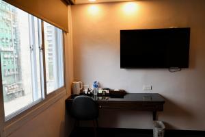 Sjónvarps- og/eða afþreyingartæki á Hub Hotel - Zhongshan Branch