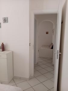 A bed or beds in a room at Angolo di Grecia