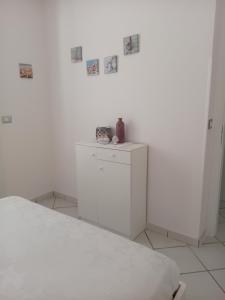 A bed or beds in a room at Angolo di Grecia