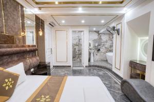 a hotel room with a bed and a bathroom at Bao Ngọc Hotel Dương Nội in Hanoi