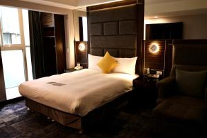 Rúm í herbergi á Hub Hotel - Zhongshan Branch