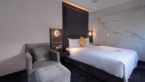 Rúm í herbergi á Hub Hotel - Zhongshan Branch