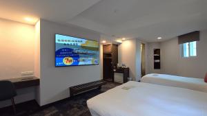 Rúm í herbergi á Hub Hotel - Zhongshan Branch
