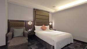Rúm í herbergi á Hub Hotel - Zhongshan Branch