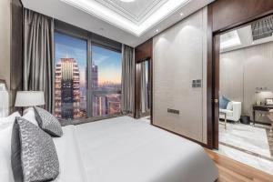 Postel nebo postele na pokoji v ubytování Roosevelt Service Apartment Chongqing Jiefangbei Pedestrian Street Hongyadong Branch