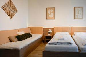 Postel nebo postele na pokoji v ubytování Aparthotel Neudörfl