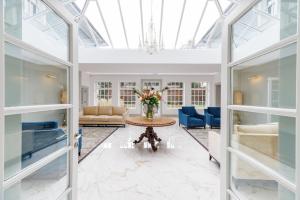 a large living room with a glass ceiling at Rochtaine Kilkenny, Mount Juliet Estate in Ballynamona