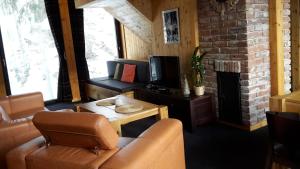 Posezení v ubytování Krakonošova Dílna "WOODHAUS"