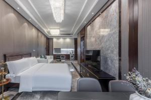 Postel nebo postele na pokoji v ubytování Roosevelt Service Apartment Chongqing Jiefangbei Pedestrian Street Hongyadong Branch