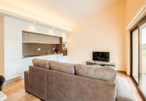 TV a/nebo společenská místnost v ubytování Can Cintet 3 Apartamento con terraza en Besalú