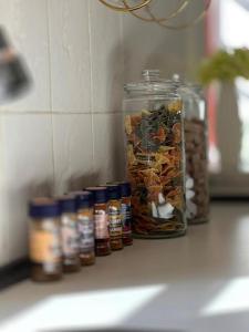 a group of jars of food sitting on a counter at Byens Bed and Bath in Nakskov