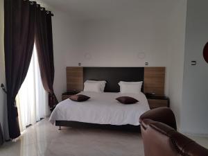 Postel nebo postele na pokoji v ubytování Hotel D'orient