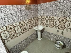 a bathroom with a sink and a toilet at Coorg hill in Somvārpet