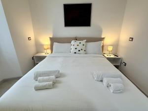 Ένα ή περισσότερα κρεβάτια σε δωμάτιο στο 5 minuti Duomo - Metro M4 Argonne - Linate Airport