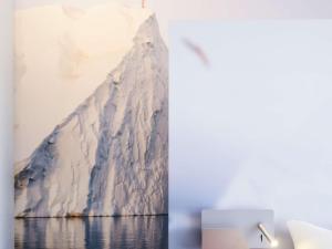 a painting of a glacier on a wall at ibis Styles Toulon Centre Port in Toulon