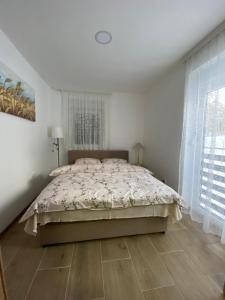 Posteľ alebo postele v izbe v ubytovaní Apartman Emilija