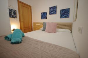 Łóżko lub łóżka w pokoju w obiekcie Livingtarifa Apartamento Paradise