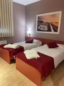 Postel nebo postele na pokoji v ubytování Motel Vespucci