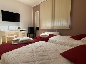 Postel nebo postele na pokoji v ubytování Motel Vespucci