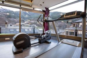 a gym with a view of a mountain at Hotel Cervol by Nexta in Andorra la Vella +22 photos