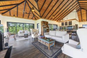 a living room with white furniture and a wooden ceiling at Echor Hill Farm Cottages Palampur in Pālampur